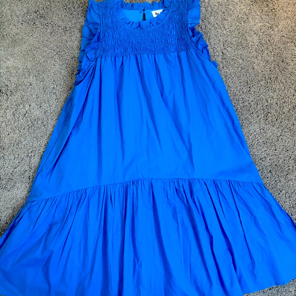 Short blue dress with ruffle details